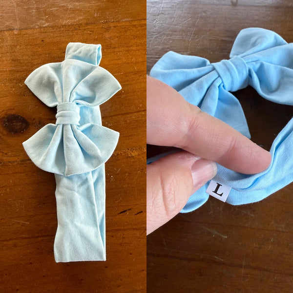 Light blue Sz L bow 21.5cm 1-3y NWOT