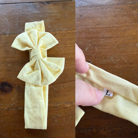 Light yellow Sz L bow 21.5cm 1-3y NWOT