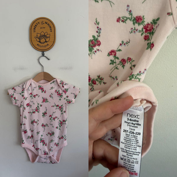 Next pink floral bodysuit Sz 00 as new