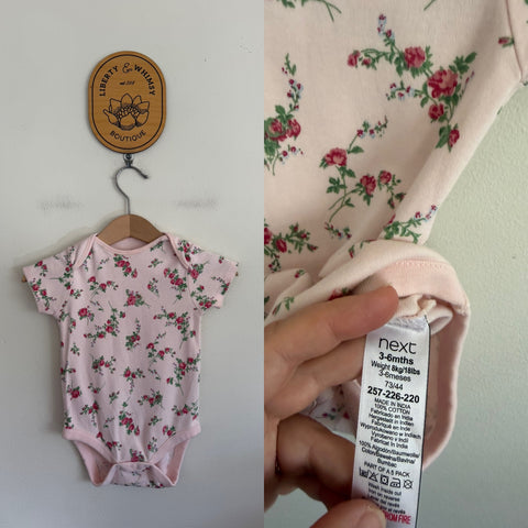 Next pink floral bodysuit Sz 00 as new