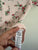 Next pink floral bodysuit Sz 00 as new