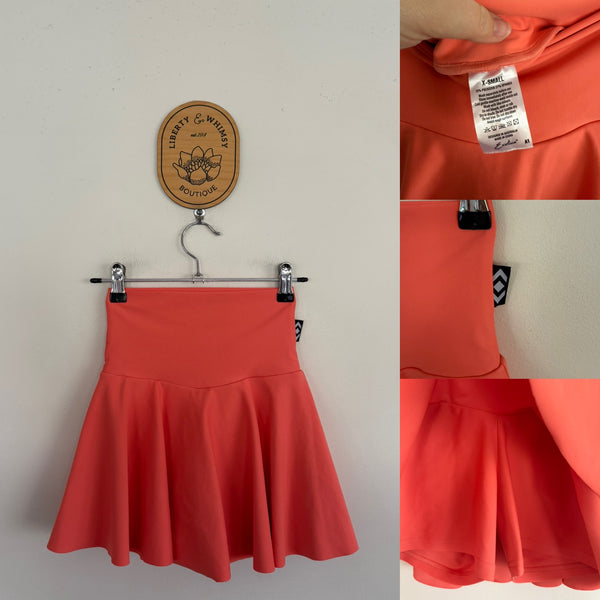 Exotica Athletica peach skirt Sz XS (approx girls 10-12) as new